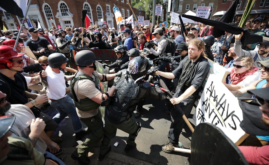White nationalists, neo-Nazis and members of the "alt-right" clash with counter-protesters as they enter Emancipation Park during the "Unite the Right" rally August 12, 2017 in Charlottesville, Virginia.