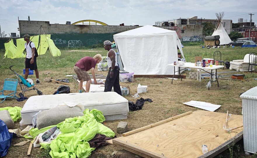 Volunteers dismantle the "Clintonville" campsite on the last day of the Democratic National Convention.