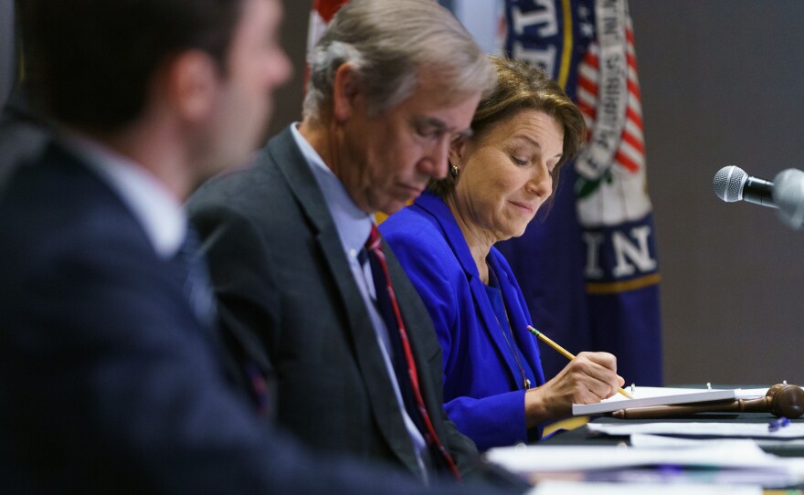Sen. Amy Klobuchar, D-Minn., takes notes during a Senate Rules Committee field hearing on July 19 in Atlanta on the issue of voting rights. Klobuchar and several other Democratic senators have unveiled new voting legislation.
