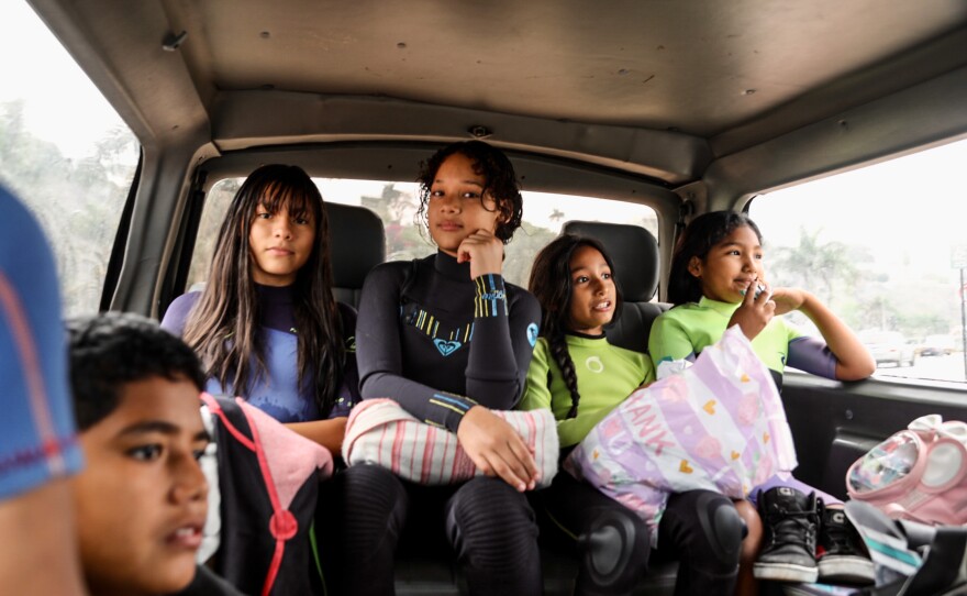 Surf students in the Alto Peru van on the way to the beach.