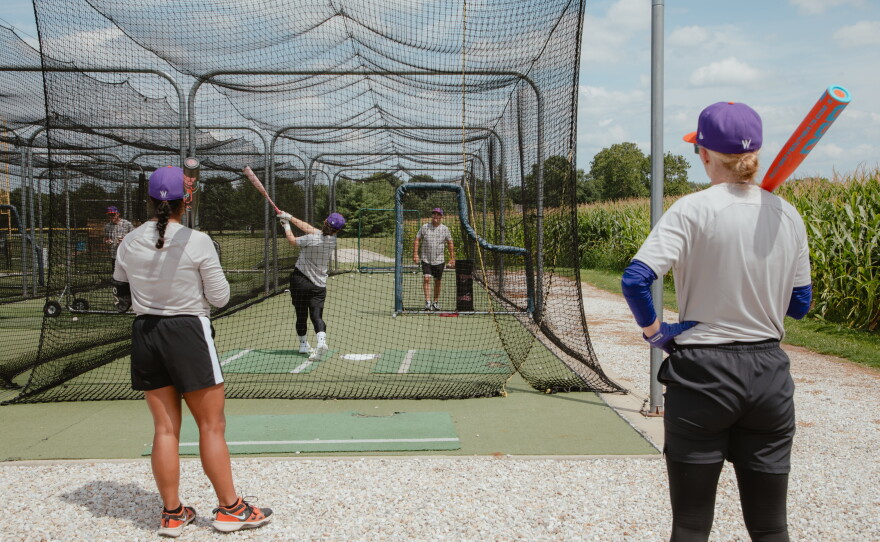 The San Francisco Firebells get in some batting practice at the University of Illinois, Springfield's training field before the WPBL's inaugural weekend on Thursday, July 30.