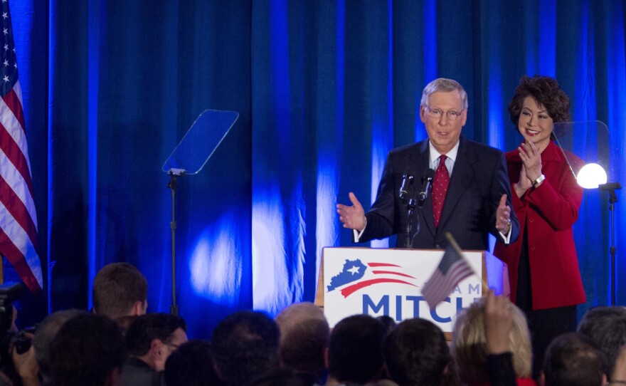 Sen. Mitch McConnell is accompanied by his wife Elaine Chao at his victory event in Louisville, Kentucky, on Tuesday.
