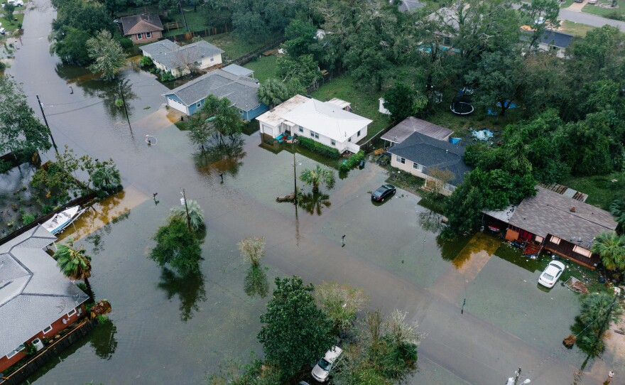 An aerial photo shows mass flooding in West Pensacola near the Bayou Grove and Mulworth neighborhoods in Florida. The area was hit hard by Hurricane Sally, which continues to cause flooding threats.