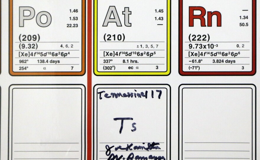 An entry on the periodic table of the elements filled in and autographed by physics professors Joe Hamilton and A. V. Ramayya is displayed at Vanderbilt University in Nashville, Tenn. Their research team discovered a new element and named it tennessine after Tennessee.