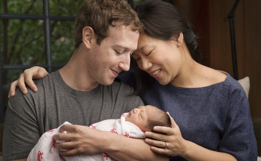 Max Chan Zuckerberg's parents are marking her birth by promising to give most of their Facebook shares to charity over their lifetimes. The family is pictured in this photo provided by Mark Zuckerberg.