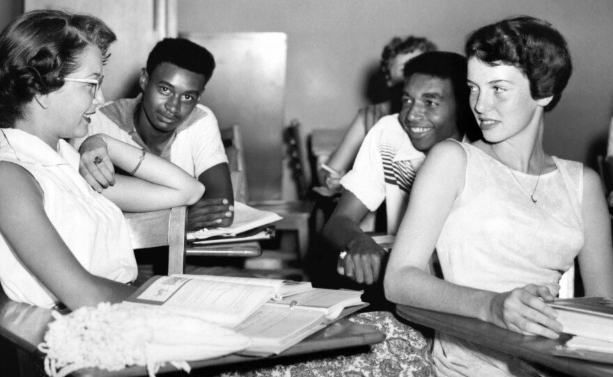 Students chat while waiting for history class to start at Oak Ridge High School in September of 1955, when the once all-white high school was desegregated by order of the Atomic Energy Commission. The Tennessee city's school board is now formally including the story of its integration in its curriculum.