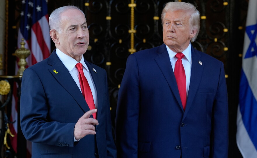 President Donald Trump listens as Israel's Prime Minister Benjamin Netanyahu speaks at President Donald Trump's Mar-a-Lago club, Dec. 29, 2025, in Palm Beach, Fla.