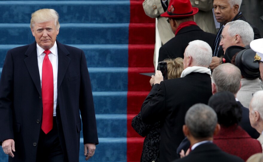 President Trump walks down the steps of the U.S. Capitol on Friday.