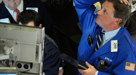 Stephen Mara, of Quattro M Securities, watches in shock as the Dow Jones industrial average fell almost 1,000 points in a matter of 16 minutes. The markets later pared most of their losses, but it's still unclear what led to the wild sell-off.