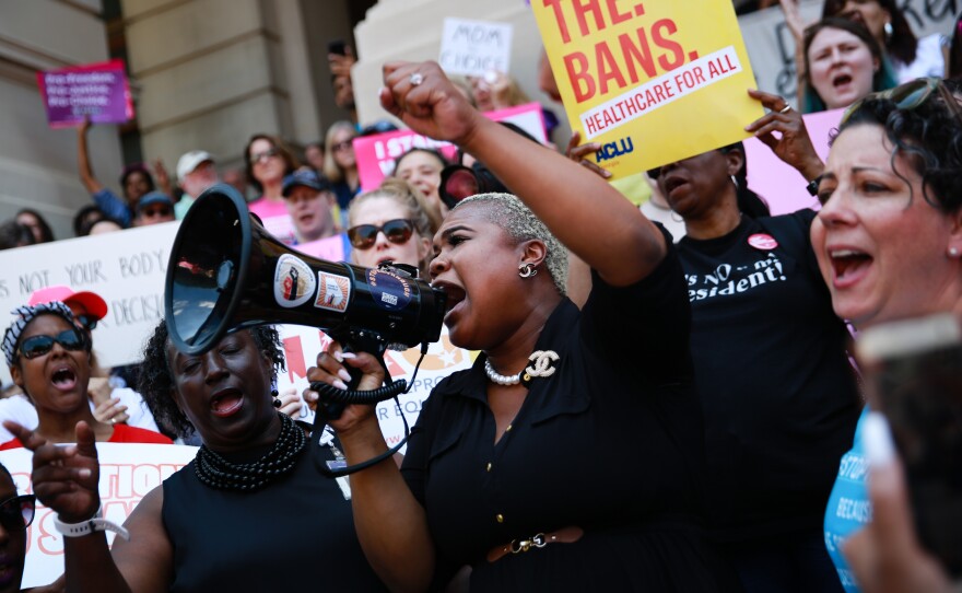 Georgia state Rep. Erica Thomas speaks during a protest against recently passed abortion-ban bills at the state Capitol on May 21 in Atlanta.