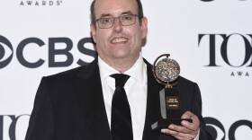 Christopher Ashley poses in the press room with the award for best direction of a musical for "Come From Away" at the 71st annual Tony Awards on Sunday, June 11, 2017. 