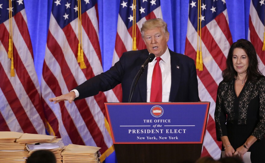 President-elect Donald Trump speaks as one of his attorneys listens during a news conference Wednesday at Trump Tower in New York.