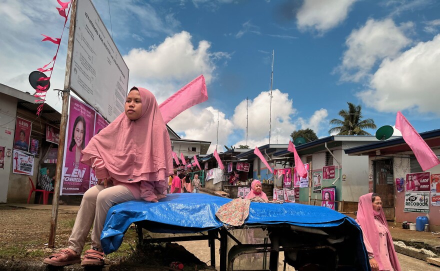 Supporters wearing pink hijabs for Leni Robredo presidential campaign.