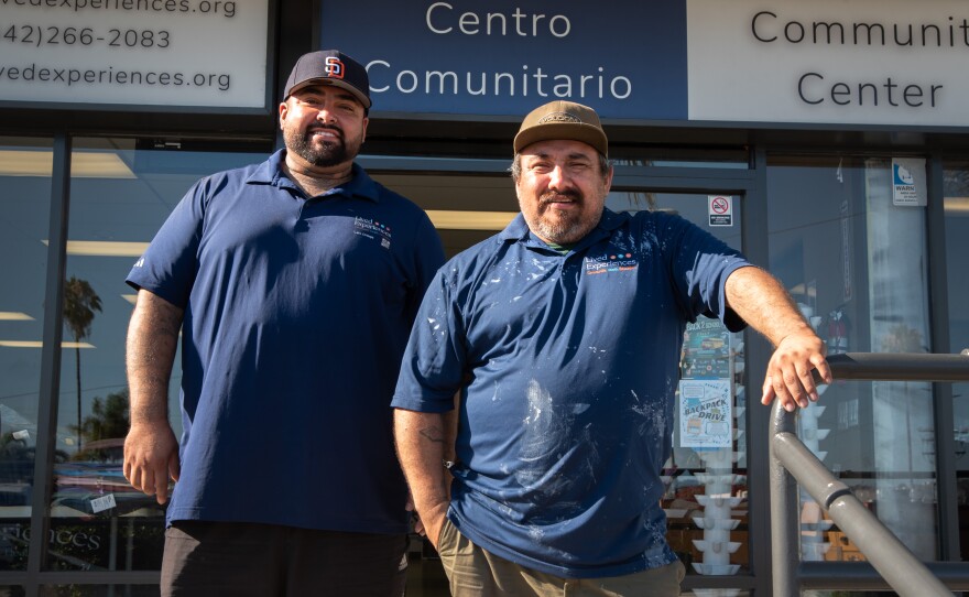 Lalo Ortega (left) stands with his brother Oscarin Ortega, founder of the nonprofit Lived Experiences, outside their north Oceanside location on July 31, 2025. 
