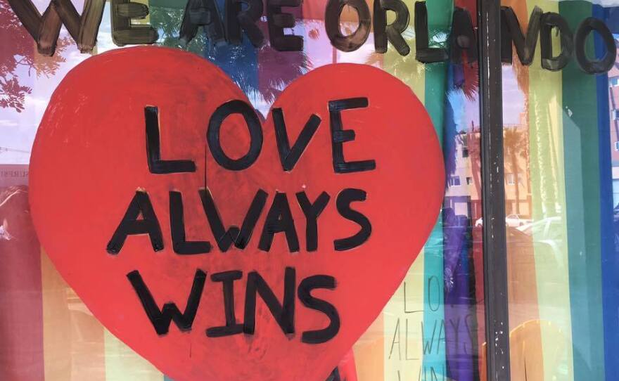 A sign on the window at the North County LGBTQ Resource Center in Oceanside reads "We are Orlando. Love always wins," June 12, 2016. 