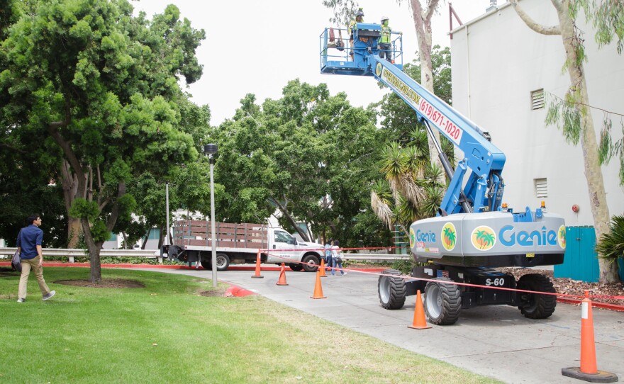 Construction workers are shown at San Diego State University's Professional Studies and Fine Arts building on July 25, 2019. Many students and faculty have relocated to other buildings during renovations.