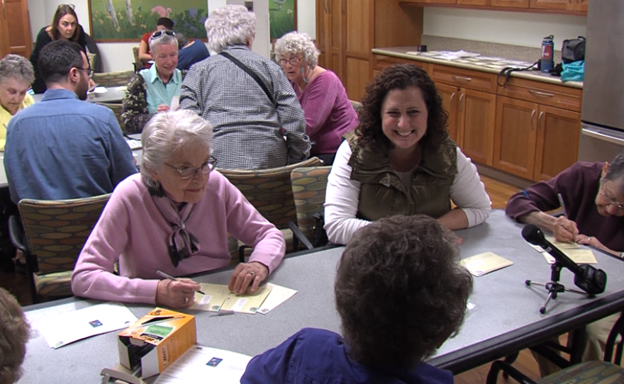 Women at Seacrest Village, and some of their helpers, gather for a letter-writing campaign to their local lawmakers to raise their concerns about changes coming from the White House, Feb. 7, 2017.