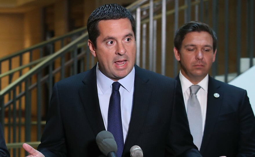 House Intelligence Committee Chairman Devin Nunes, R-Calif., speaks while flanked by and Rep. Don DeSantis, R-Fla., as he announces that his committee and the House oversight committee are starting an investigation into a 2010 deal between Russia and the Obama Administration.