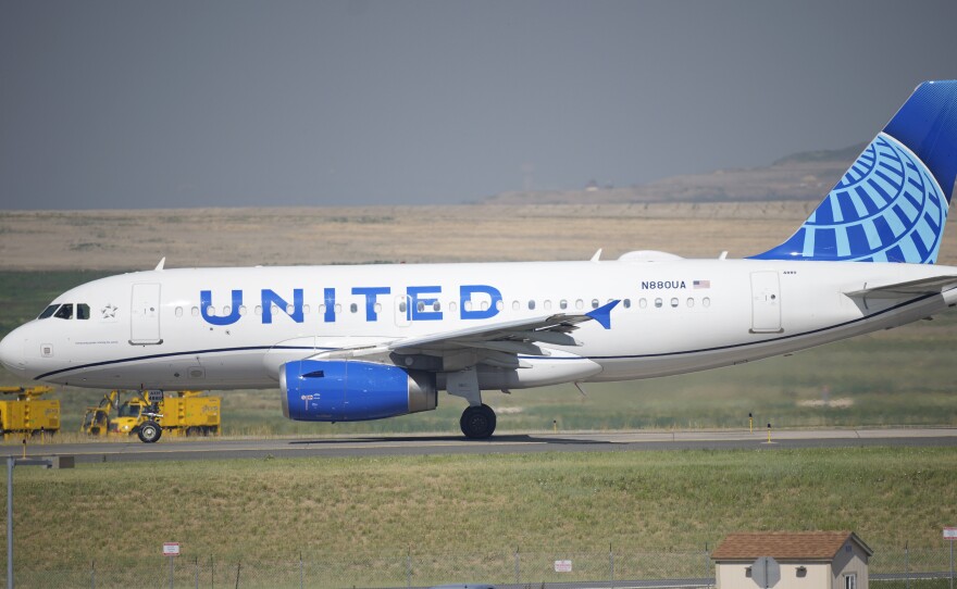 A United Airlines jetliner taxis down a runway for take off from Denver International Airport last month. The carrier has become the first major U.S. airline to require employees be vaccinated against COVID-19.