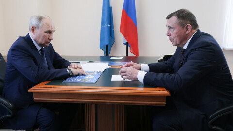 Russian President Vladimir Putin, left, listens to Sakhalin Region Governor Valery Limarenko in Kurilsk on the Iturup Island, the largest of the Kuril Islands of Russia's fareast, on Thursday, Aug. 13, 2026.
