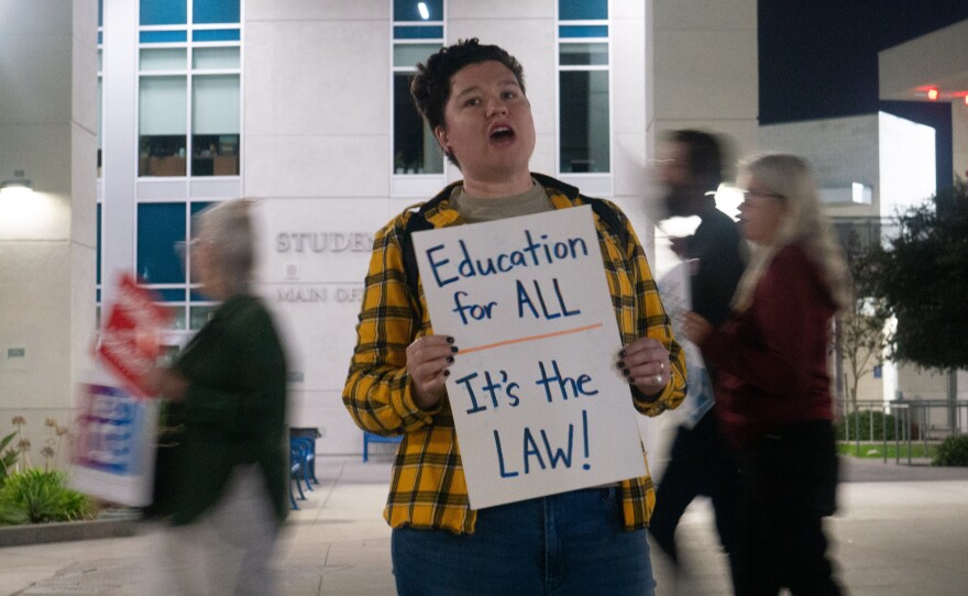 Madeline McCurry-Schmidt, a local resident in East County, participated in the rally before the meeting on Nov. 13, 2025.