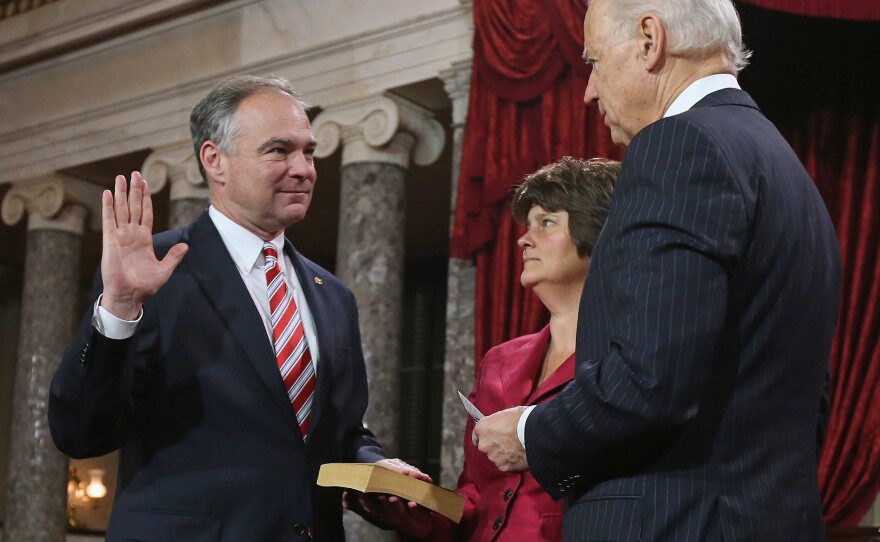 Sen. Tim Kaine participates in a swearing-in with his wife Anne Holton and Vice President Joe Biden in the Capitol on Jan. 3, 2013 in Washington, D.C.