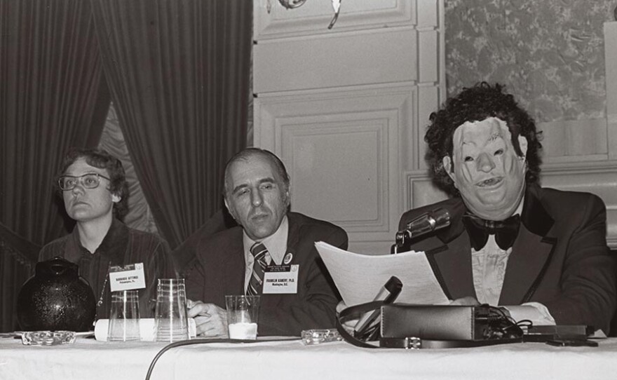 Disguised as "Dr. H. Anonymous" in an oversized tuxedo and distorted Nixon mask, Dr. John Fryer sent shock waves through the American Psychiatric Association's 1972 convention by describing his life as a closeted gay psychiatrist.