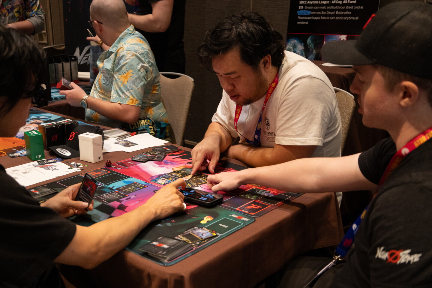 Friends play a game in one of the gaming rooms at the Marriott Marquis during Comic-Con, July 24, 2026.