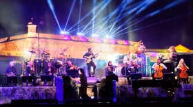 Yanni, backed by his orchestra, performs at the historic 16th-century Castillo San Felipe del Morro in San Juan, Puerto Rico, December 2011.
