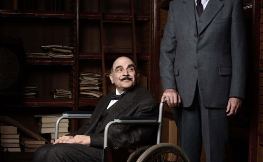 David Suchet as Hercule Poirot (in wheelchair) with Hugh Fraser as Captain Arthur Hastings.