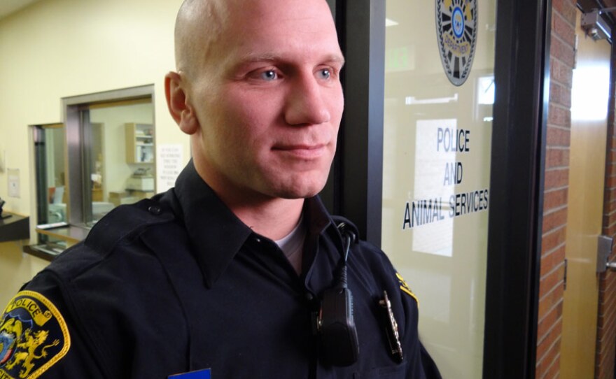 SRO Tom Tomlinson, Roy police officer, being interviewed at Roy High School.