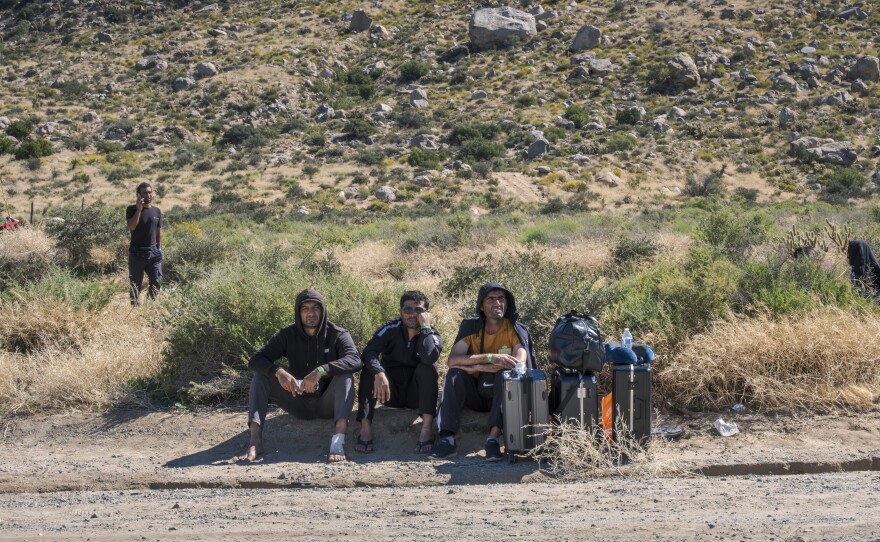 Migrants wait in the desert near Jacumba Hot Springs for immigration processing, October 6, 2023.<br/>