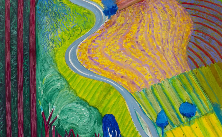 Hockney's paintings are full of vivid, saturated colors. Above is his 2000 work,<em> Going Up Garrowby Hill.</em>