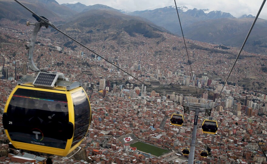 The first of eight proposed cable lines linking Bolivia's capital La Paz (shown in the background) with El Alto, was opened earlier this year. The government hopes the cable cars will ease the chronic congestion are planning the largest cable car system in the world.