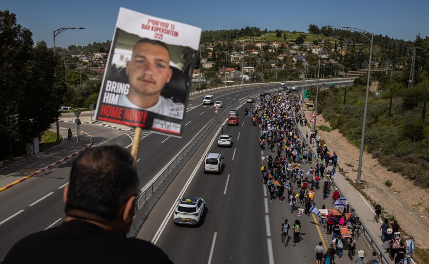 Demonstrators near Beit Shemesh, Israel, carry stretchers representing each of the 134 Israelis still being held by Hamas on March 1. Amid fraught negotiations over conditions for a cease-fire, the families of the hostages held a four-day march from areas attacked on Oct. 7 in southern Israel to Jerusalem.