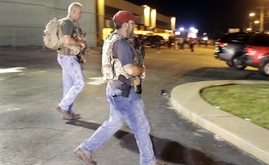 Heavily armed civilians with a group known as the Oath Keepers in Ferguson, Mo., early Tuesday. St. Louis County Police Chief Jon Belmar has said the presence of the group was "both unnecessary and inflammatory."