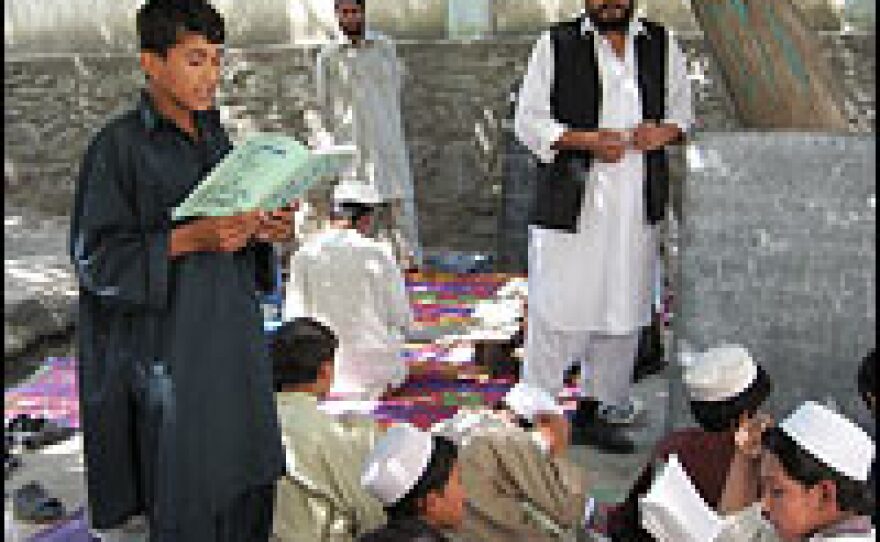 Hajigol, 13, recites from his Pashto reader at the Dar Ulum school in Laghman province.