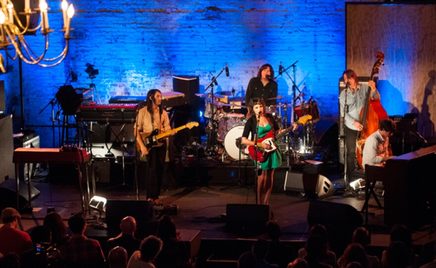 L to R: Jason Roberts, Norah Jones, Greg Wieczorek, Josh Lattanzi and Pete Remm. In front of 200 invited guests, singer-songwriter and pianist Norah Jones performs a career-spanning set at the historic Green Building in Brooklyn's Carroll Gardens neighborhood. The rough-hewn beauty of the former brass foundry serves as a spectacular backdrop for the 20-song retrospective, which ranges from her breakthrough hit, “Don’t Know Why,” to her latest single, “Happy Pills,” from her fifth album, Little Broken Hearts.