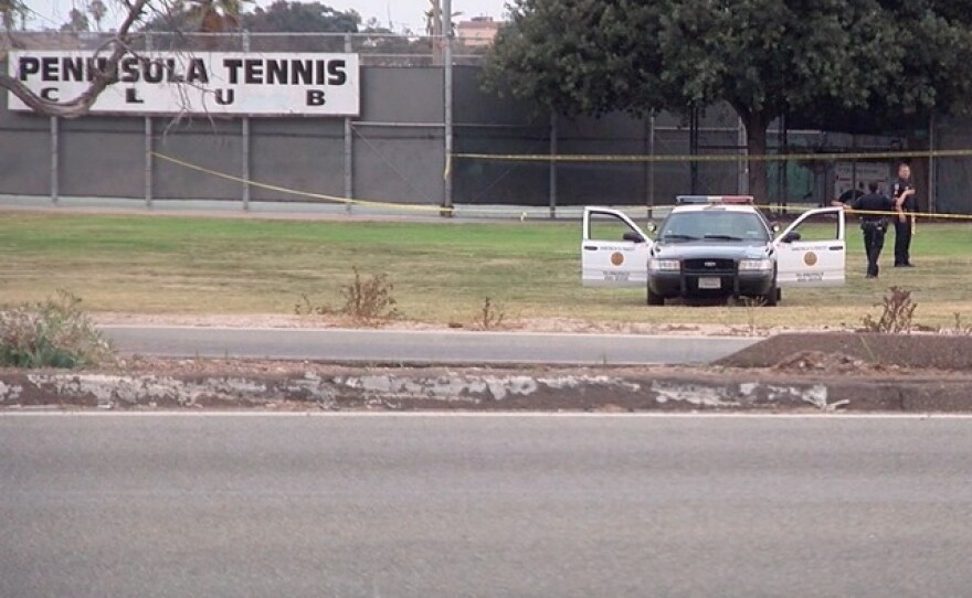 San Diego police investigate the discovery of a body near the tennis courts at Robb Field in Ocean Beach, July 4, 2016.