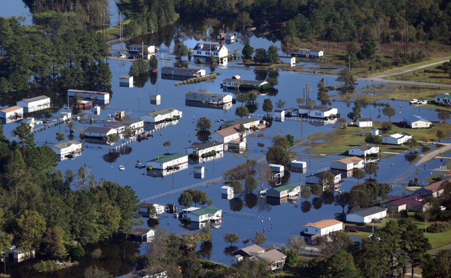 Aerial views of flooding and submerged homes in Lumberton, N.C., on Thursday.