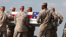 Aug. 13: At Dover Air Force Base in Delaware, the remains of Marine Lance Cpl. Gregory T. Buckley are carried during a dignified transfer. He was killed in a "green on blue" attack.