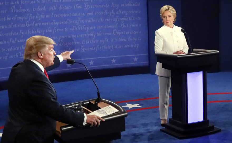 Republican presidential nominee Donald Trump debates Democratic presidential nominee Hillary Clinton on Wednesday during the third presidential debate, at UNLV in Las Vegas.