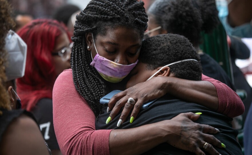 Friends and family mourn the death of Conrad Coleman Jr. following his funeral service in July of 2020 in New Rochelle, N.Y. Coleman, 39, died of COVID just over two months after his father also died of the disease.