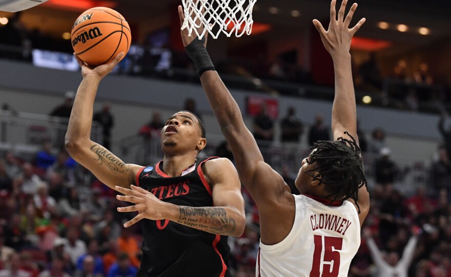 San Diego State forward Keshad Johnson (0) shoots against Alabama forward Noah Clowney (15) in the first half of a Sweet 16 round college basketball game in the South Regional of the NCAA Tournament, Friday, March 24, 2023, in Louisville, Ky.