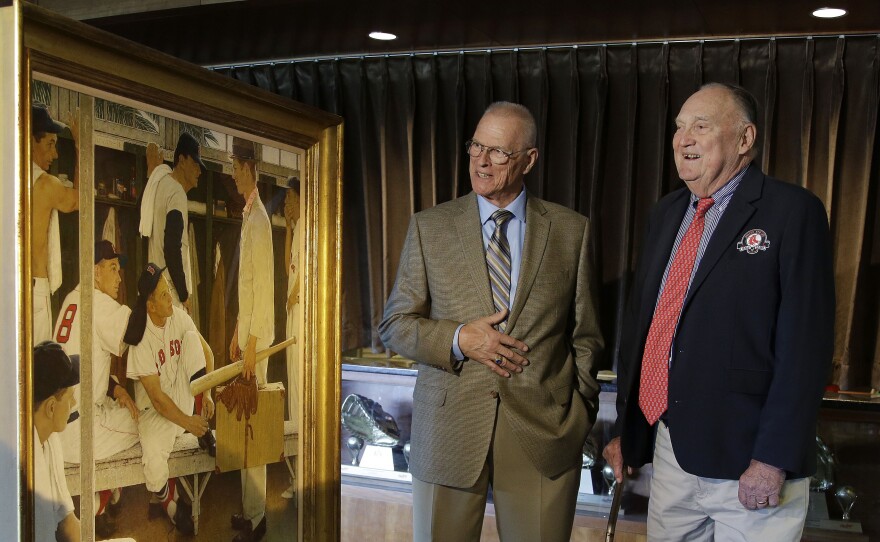 Two of the men who posed for Norman Rockwell's <em>The Rookie</em> — Frank Sullivan (right), the player with 8 on his back in the painting, and Sherman Safford, the rookie holding the suitcase — viewed the work at Fenway Park earlier this month. The painting was sold at auction Thursday.