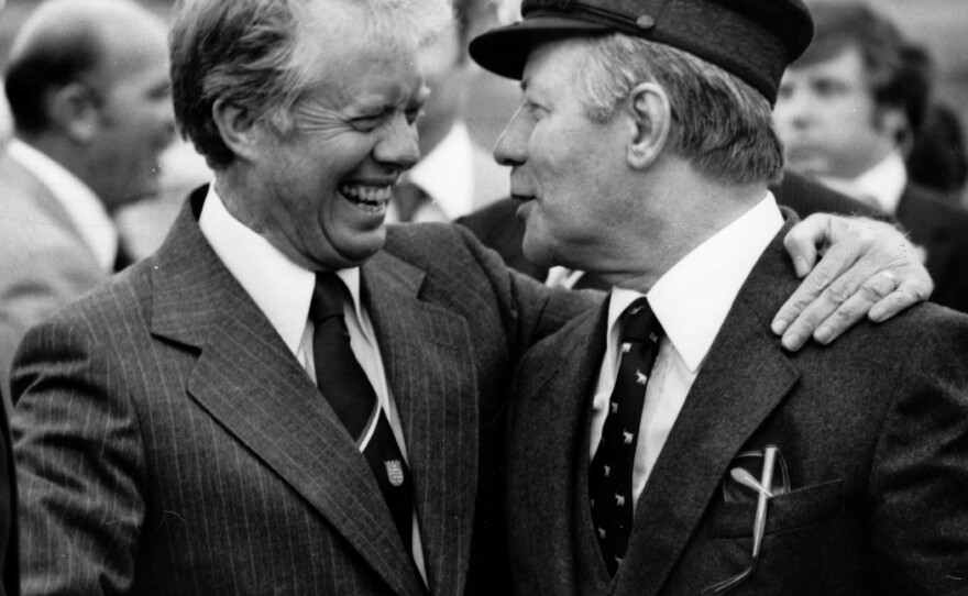 President Jimmy Carter and West German Chancellor Helmut Schmidt prepare to depart Berlin in July 1978. Although Schmidt spoke English well, he needed an interpreter's help when he was tired.