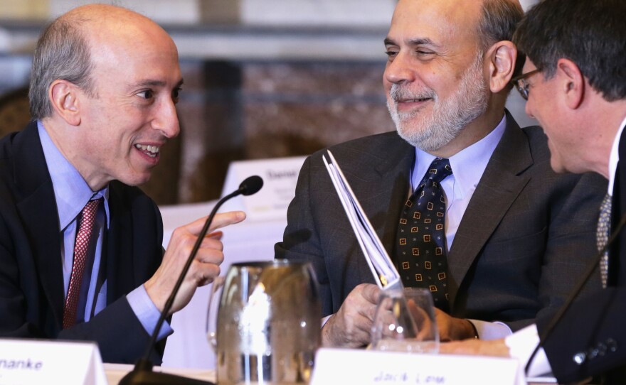 Gensler, then Chairman of the Commodity Futures Trading Commission, speaks with then-Federal Reserve Chairman Ben Bernanke and then-U.S. Treasury Secretary Jacob Lew during a meeting of financial regulators on Dec. 9, 2013, at the Treasury Department in Washington, D.C. Gensler has years of experience as a regulator.