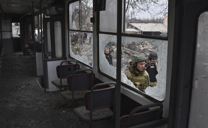 Zaporizhzhia: Servicemen are seen through the broken windows of a city tram, damaged in Russia's massive air attack.