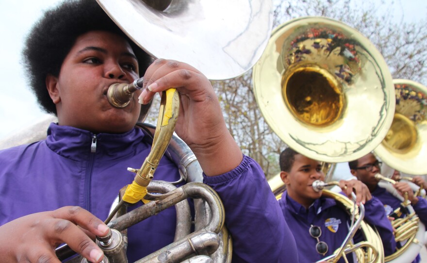 Nicholas Nooks, left, is known in the band room as "Big Nick." At nearly 300 pounds, he seemed like a good fit for football, but gave up the sport in favor of playing sousaphone and tuba.