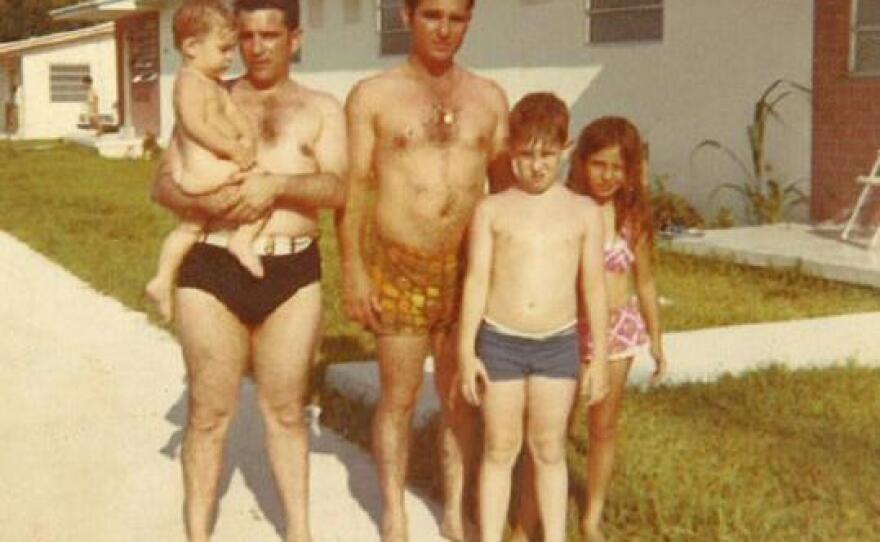 Blanco after a day at the beach, in the arms of his father, Carlos, with his Uncle Toti, brother Caco and cousin Mirita.